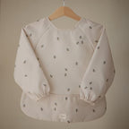 mushie Long Sleeve Baby Bib | Water Resistant Adjustable Fit - Image 2