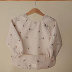 mushie Long Sleeve Baby Bib | Water Resistant Adjustable Fit - Image 3
