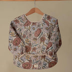 mushie Long Sleeve Baby Bib | Water Resistant Adjustable Fit - Image 3