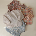 mushie Long Sleeve Baby Bib | Water Resistant Adjustable Fit - Image 3