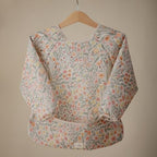 mushie Long Sleeve Baby Bib | Water Resistant Adjustable Fit - Image 2